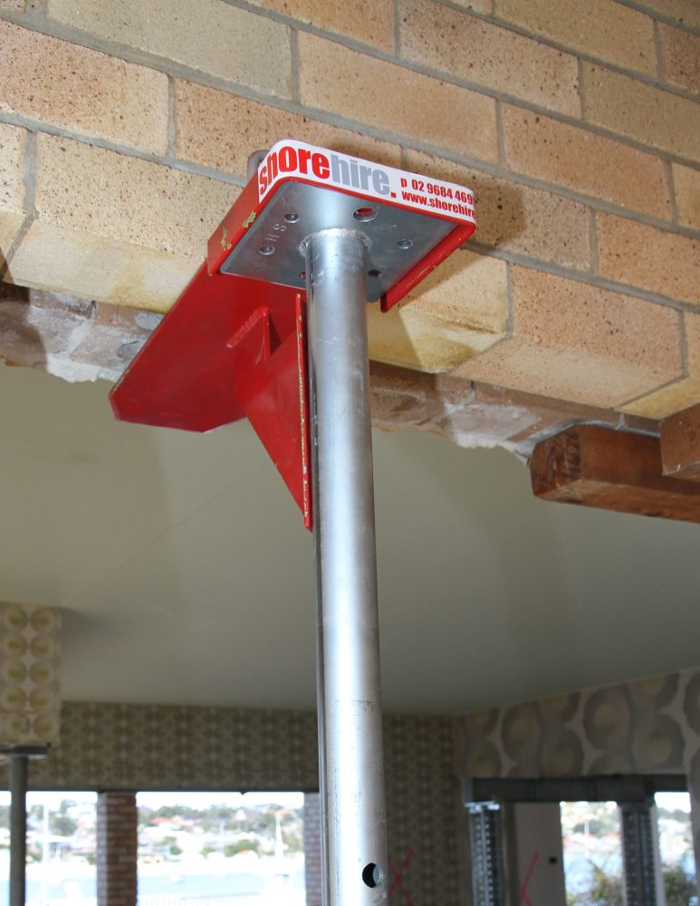 A Strong Boy being used to prop a brick wall