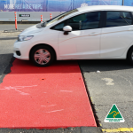 Red steel road plate Road and construction steel plate hire