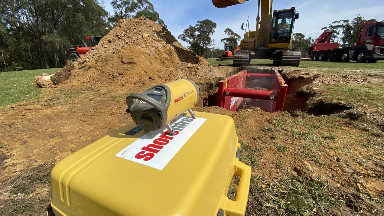 One of our lasers being used to install a shoring box One of our lasers being used to install a shoring box