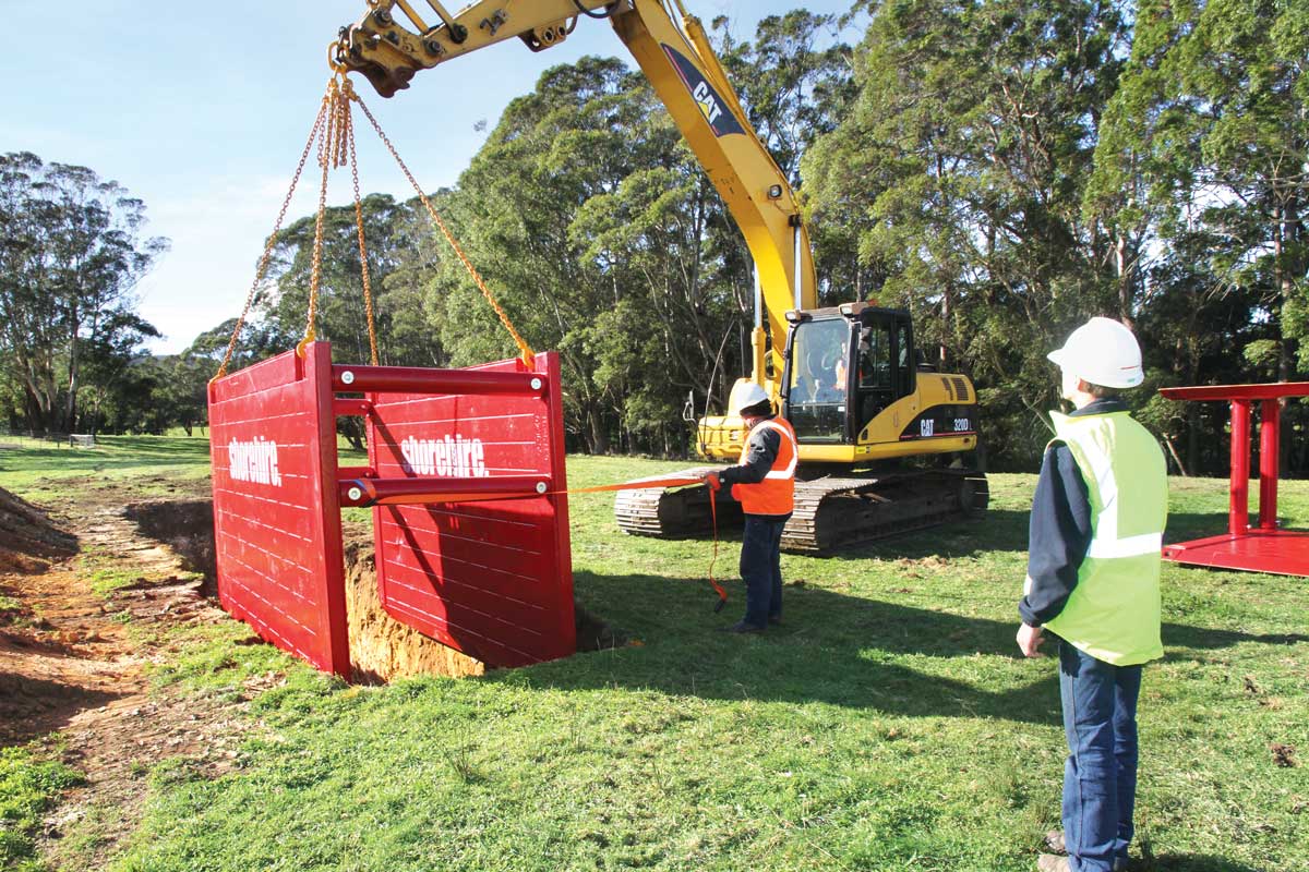 Shoreing small heroShoring-Hero-SmallCrane-and-Shoring-Box_web_size A shoring box being installed into a trench