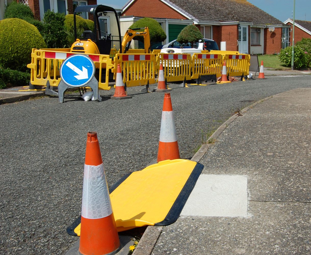 A Pedestrian Ramp sitting on a curb